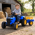 Детский электромобиль трактор Ford-New Holland M 6261EBLR-4 с прицепом и пультом, 2 мотора по 35W, EVA, экокожа, MP3, Bluetooth, синий mp-327953 фото